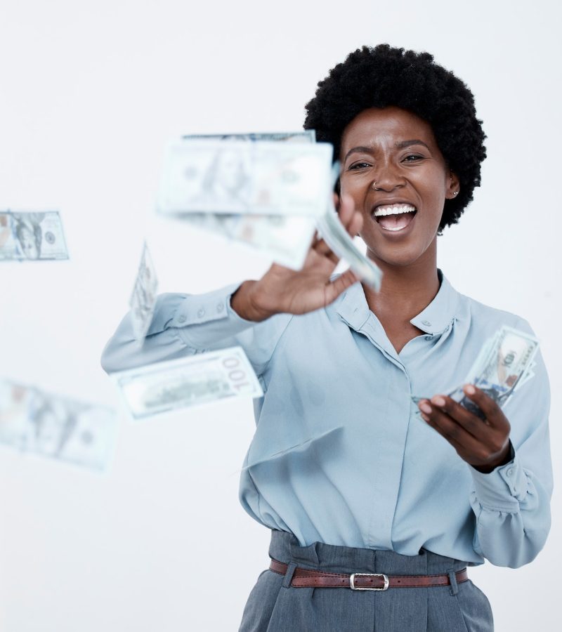 Cheerful business woman throwing money bills. Woman throwing banknotes to celebrate victory of busi